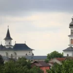 a view of a church with two towers