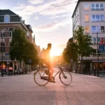 man riding bicycle on road during daytime